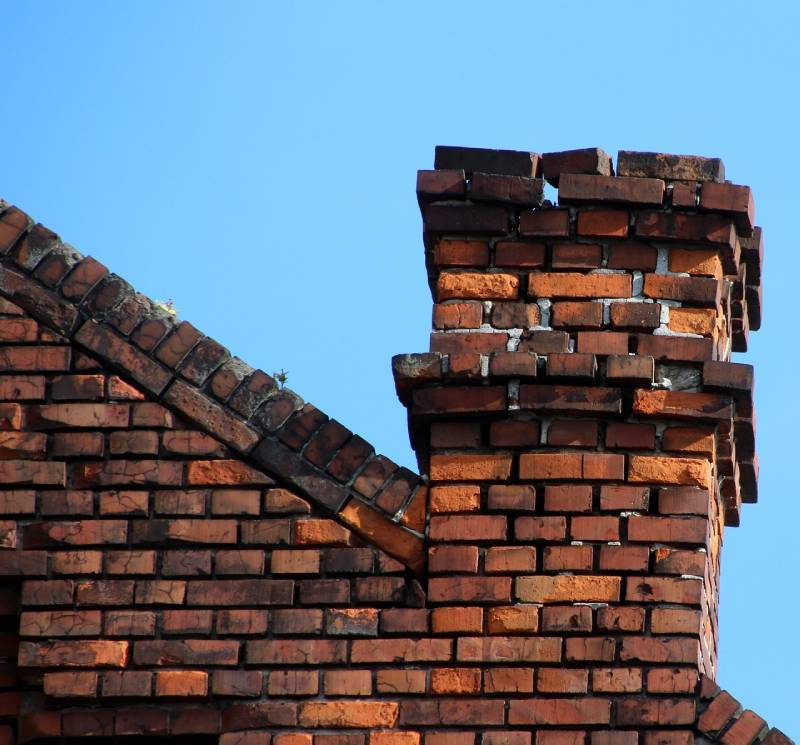 Signs Your Cooper City Home Needs a Chimney Inspection Damaged chimney on an Cooper City home showing cracks and missing mortar